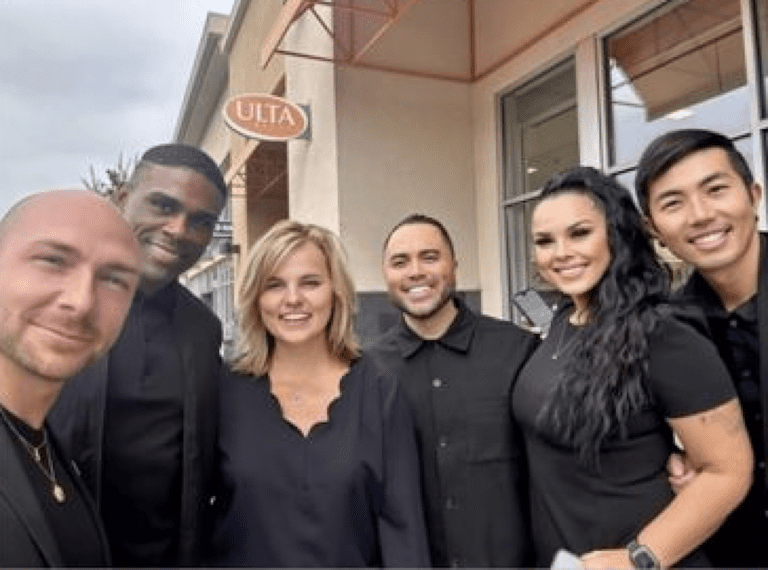 Brett Douglas with store employees